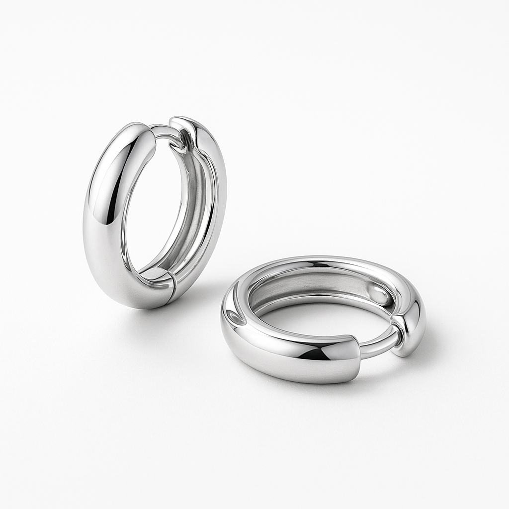 Plain huggie earrings in solid silver by Stacked&Co — handcrafted minimalist hoops made in South Africa.