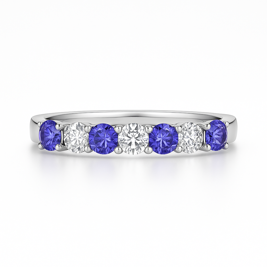Platinum ring with tanzanite gemstones and lab grown diamonds on a white background