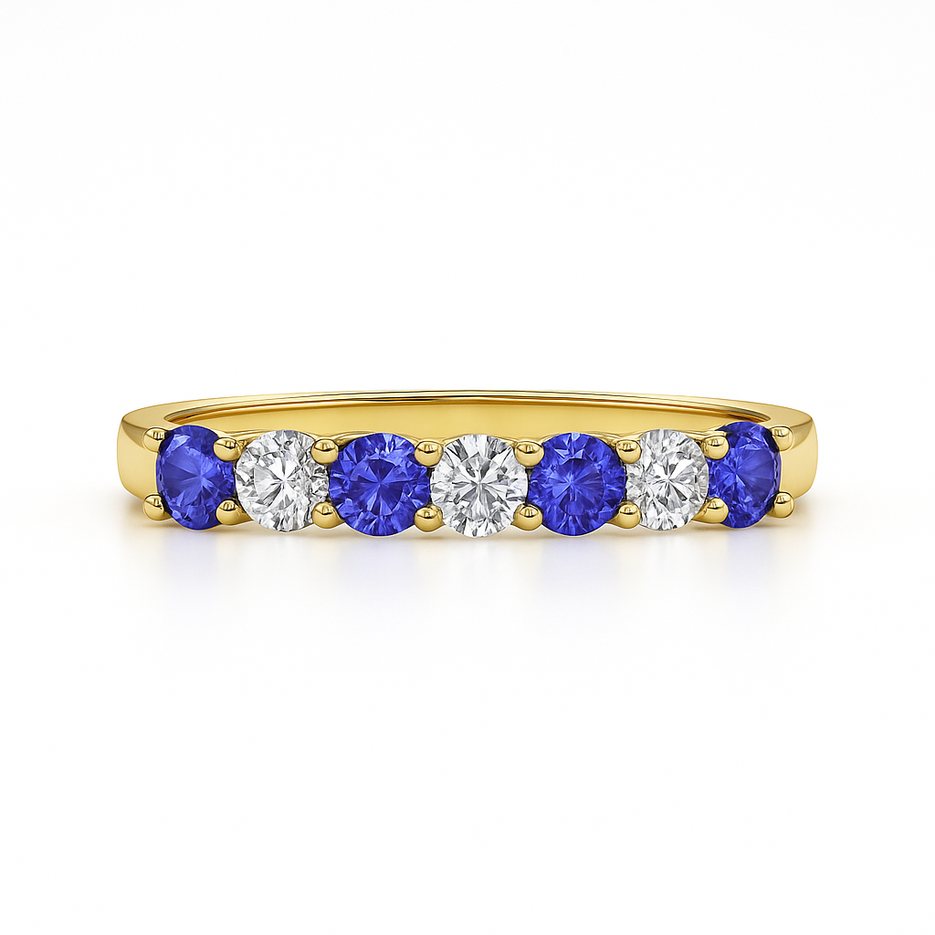 Yellow gold ring with tanzanite gemstones and lab grown diamonds on a white background